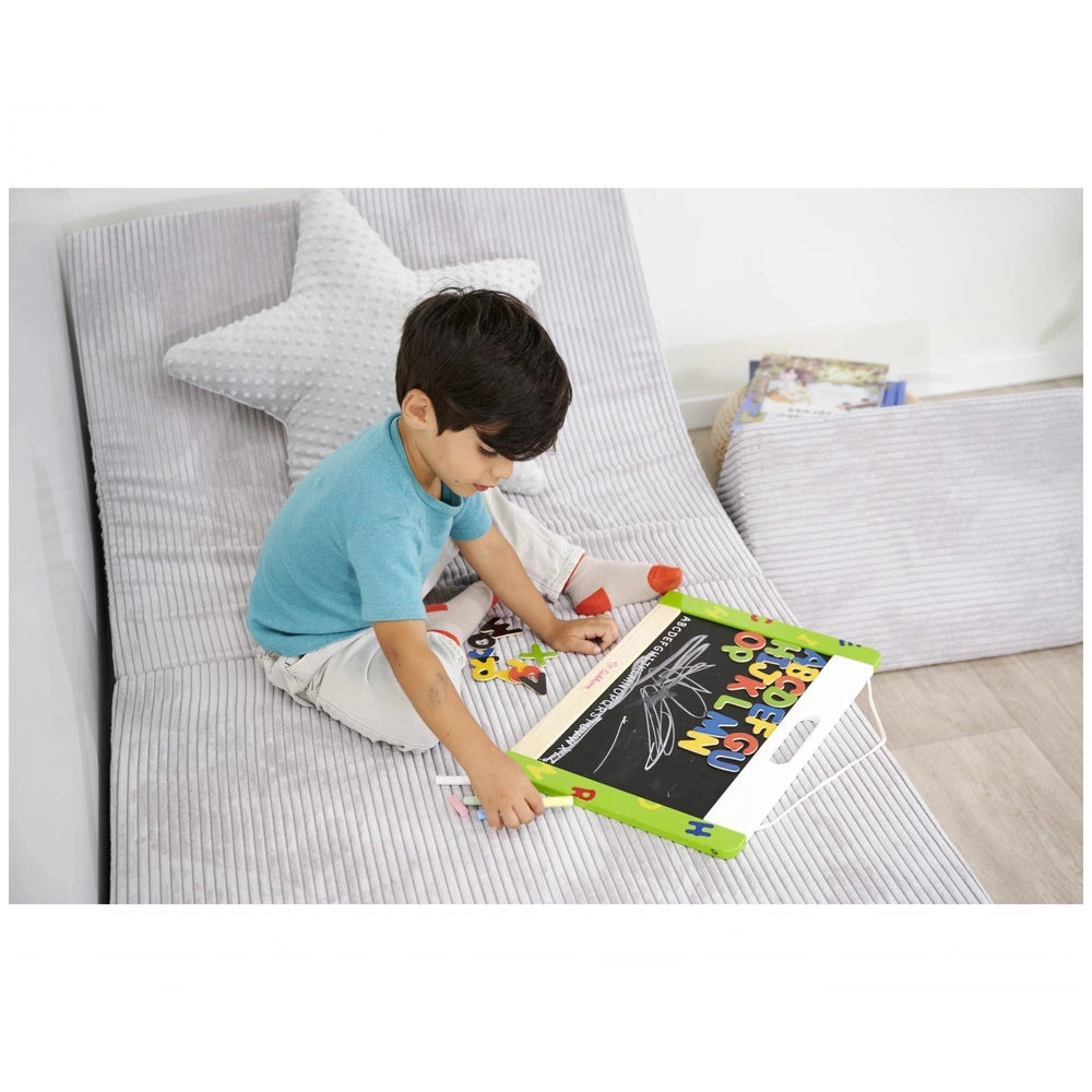 Eichhorn Magnetic and Chalkboard set with a child engaged in play, surrounded by a cozy home environment.