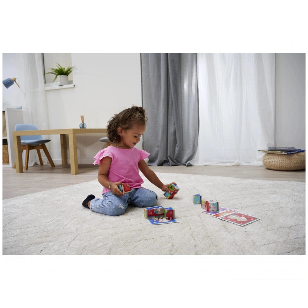 Eichhorn Picture Cube Friends set with colorful blocks on the floor, showcasing a child engaged in playful creativity.