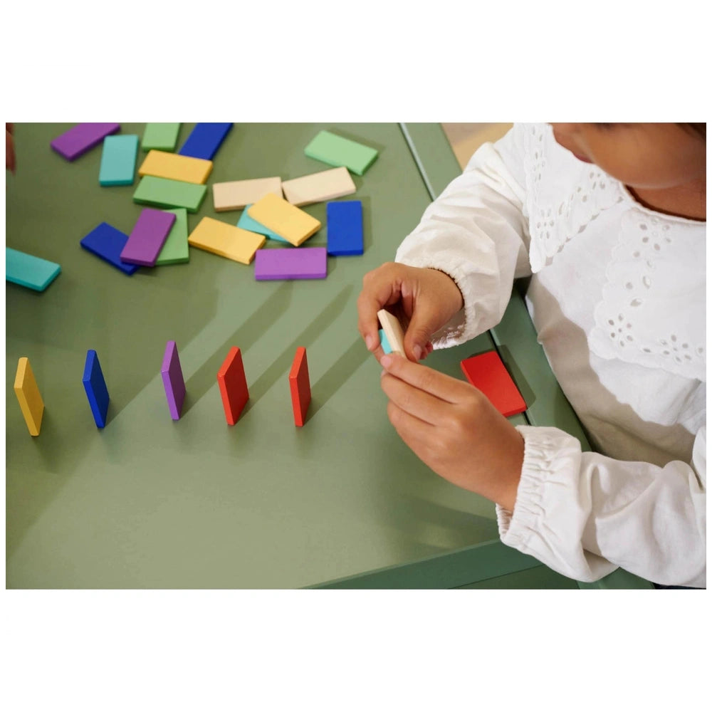 Eichhorn Wooden Domino Ralley showcasing a child playing with colorful blocks in a vibrant learning activity.