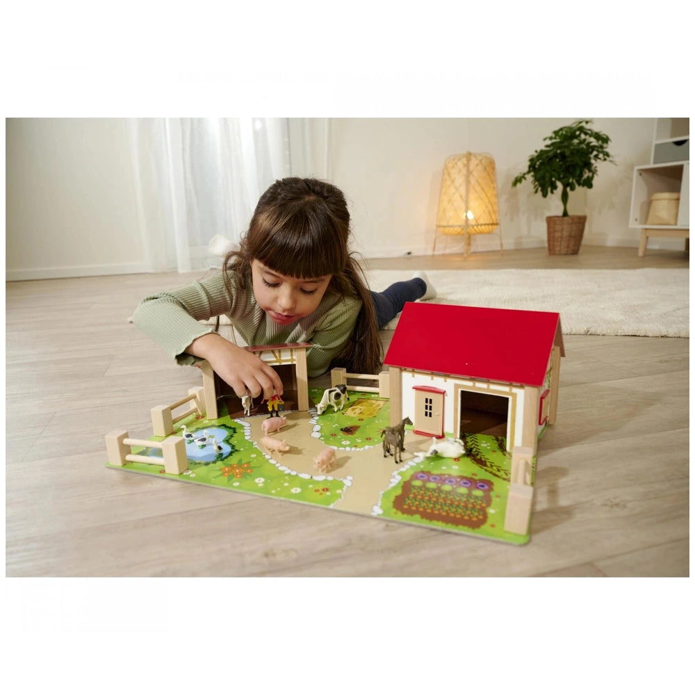 Eichhorn Wooden Farm set with 20 pieces, featuring a girl playing with a barn, animals, and a vibrant countryside scene.