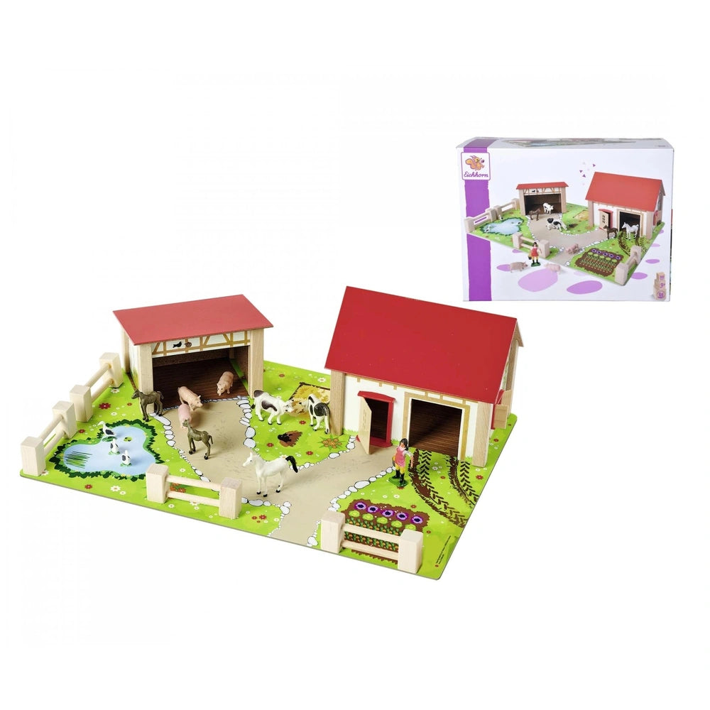 Eichhorn Wooden Farm toy set showcases a barn, animals, and green landscape, all presented in a colorful packaging box.