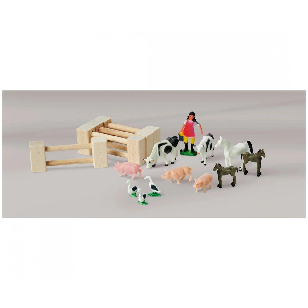 Eichhorn Wooden Farm Set with barn and 20 colorful farm animals in a playful, cartoonish design on a light background.