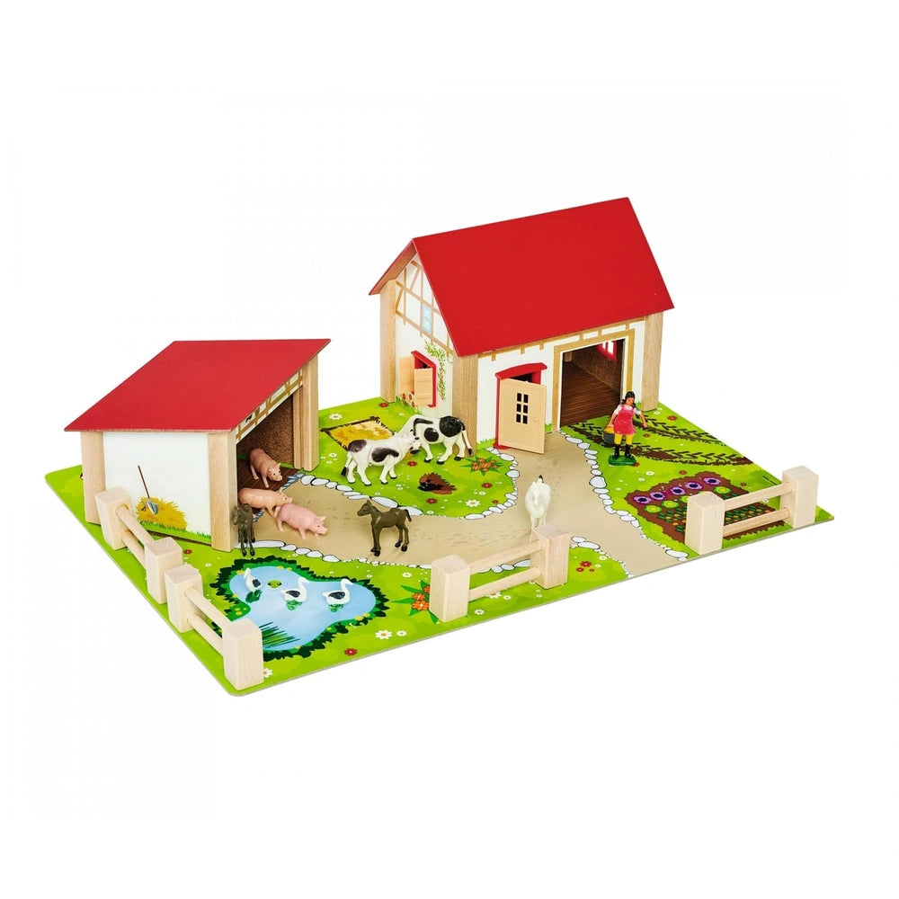 Eichhorn Wooden Farm set features a red and white barn, animals, pond, and accessories, perfect for imaginative play.
