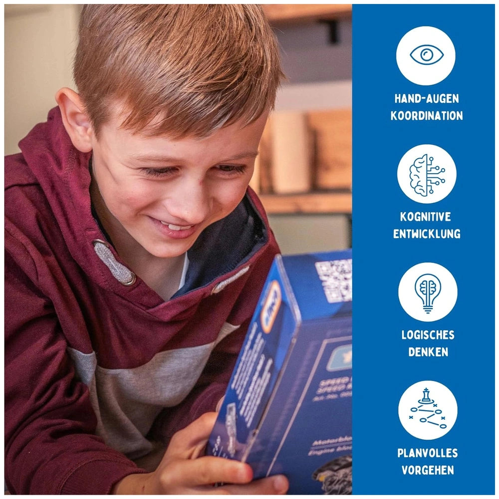 Eitech Rubin Rocket Racer blue construction set box held by a smiling boy in a red and gray hoodie, featuring a transparent w