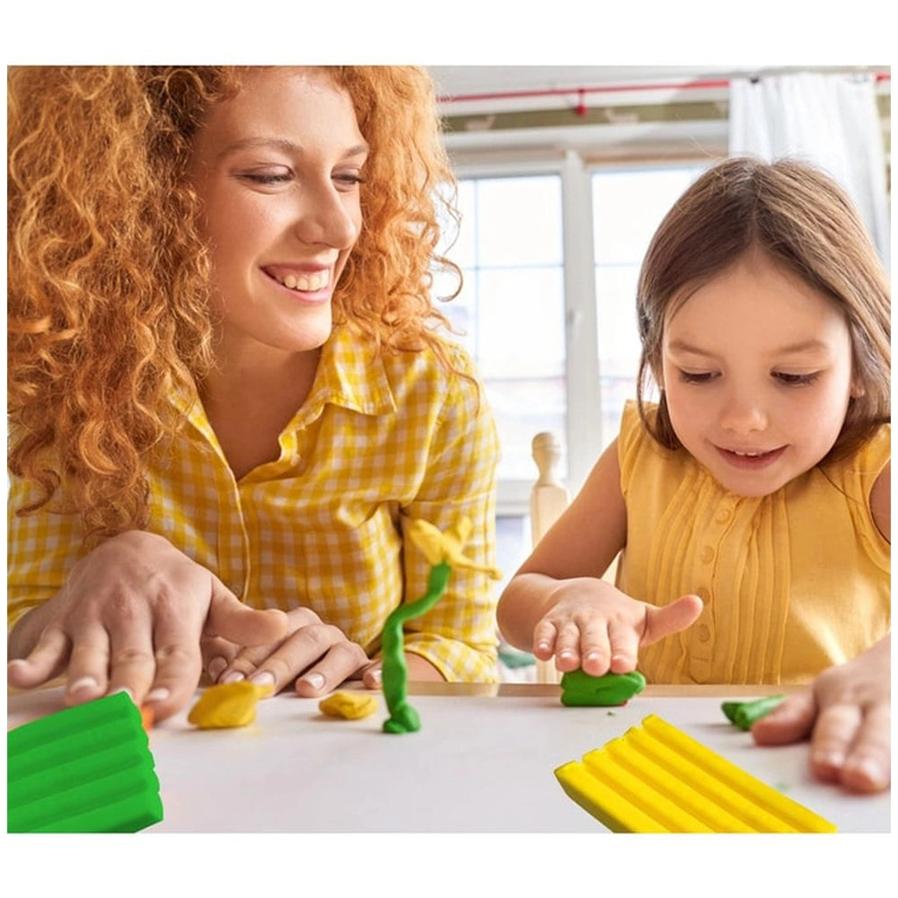 Feuchtmann Basic Modelling Dough in a transparent box, with a woman and girl smiling while playing with colorful clay on a wh