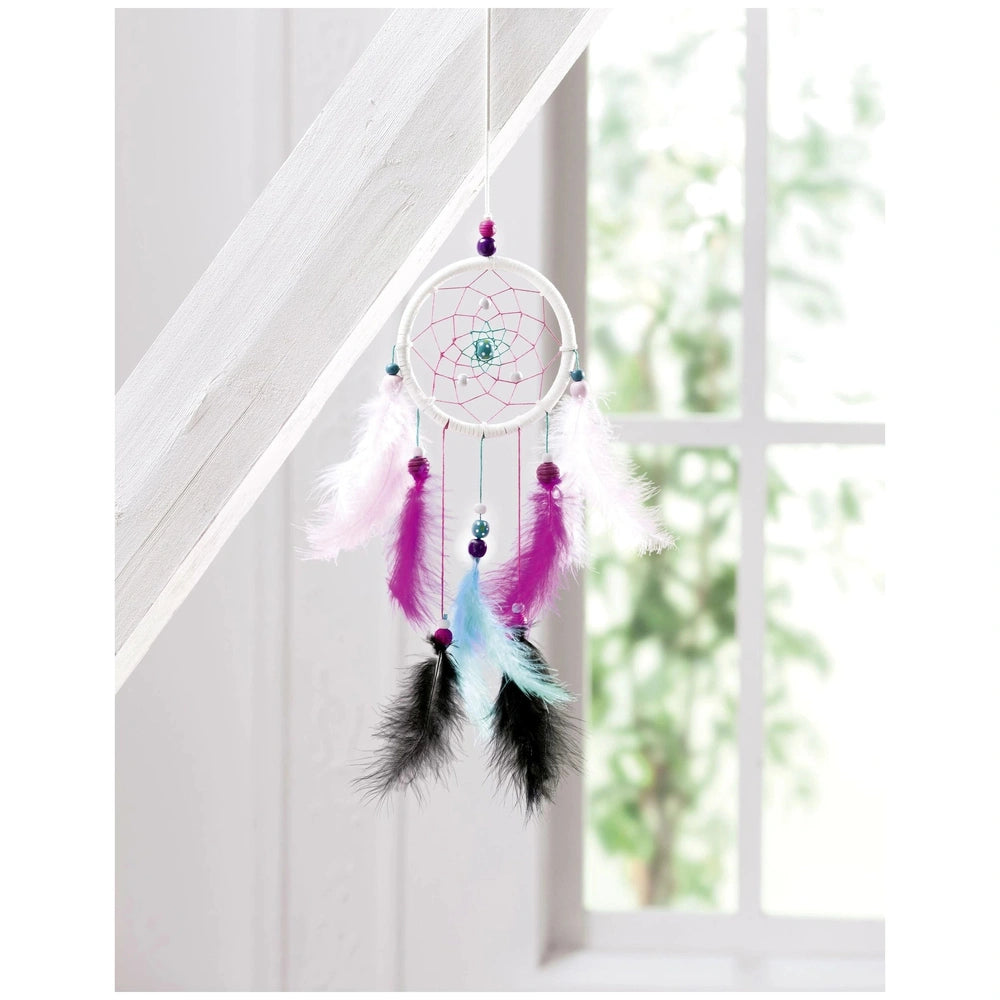 Dreamcatcher set featuring a white frame, pink and blue center, and tassels of pink, blue, and black feathers.