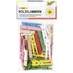 Wooden clips in various colors, packaged in glossy cardboard with a transparent window, labeled "BASIC HOLZKLAMMERN" and "48"