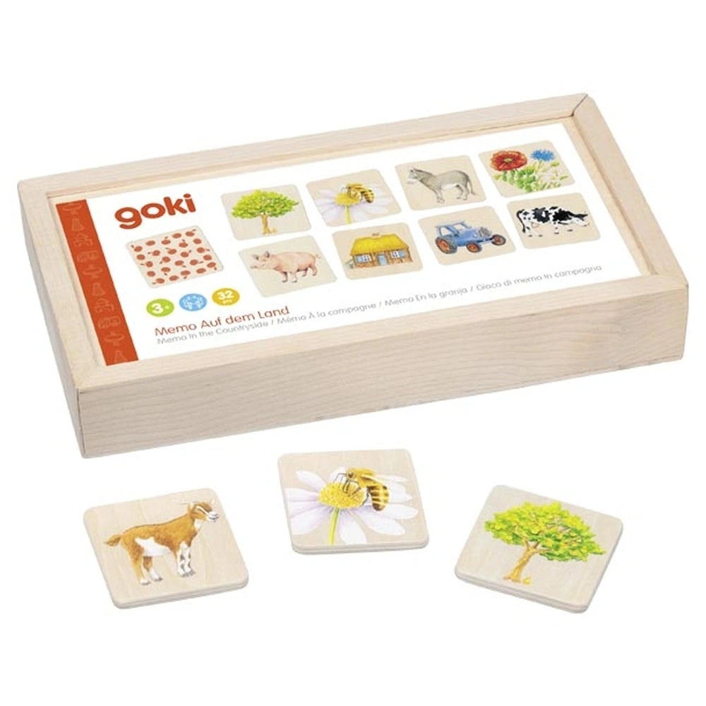 GOKI Memo In the Countryside card game packaging features a wooden box, coasters with colorful printed images, and text.