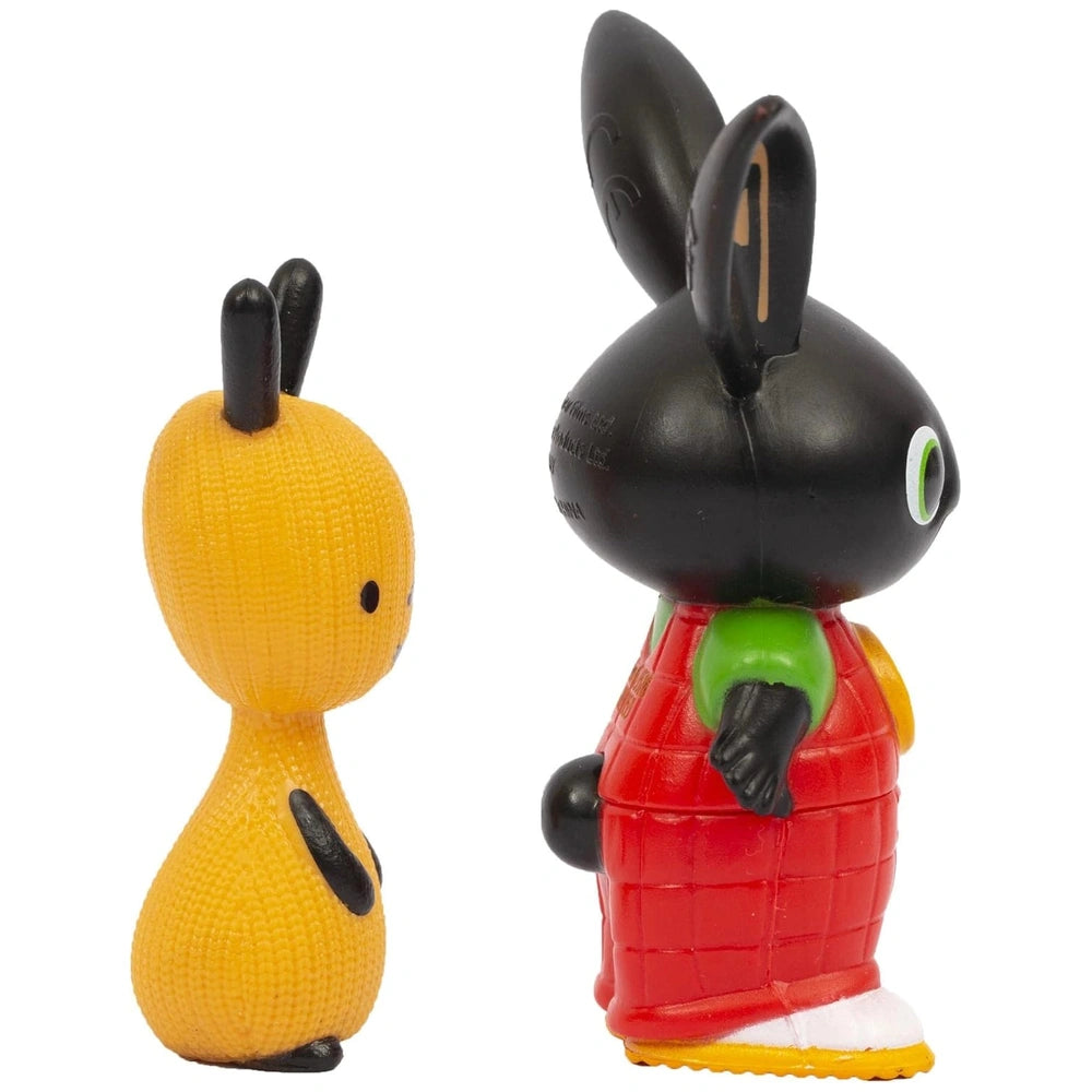 Bing Flop toy figurine features yellow and black colors, red shirt, green pants, white shoes, and a matte plastic finish.