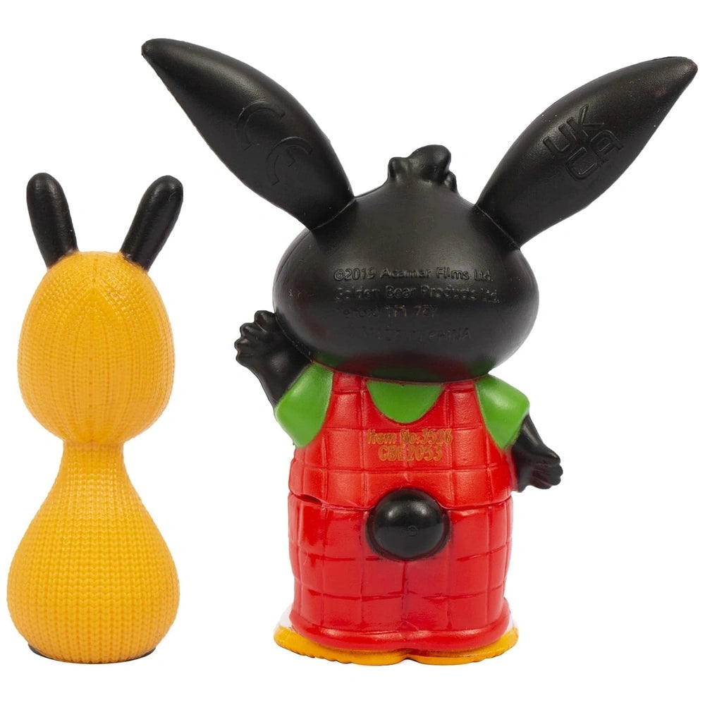 Bing Flop action figure features a yellow object with a knob and a black object with a red and green pattern and knob.