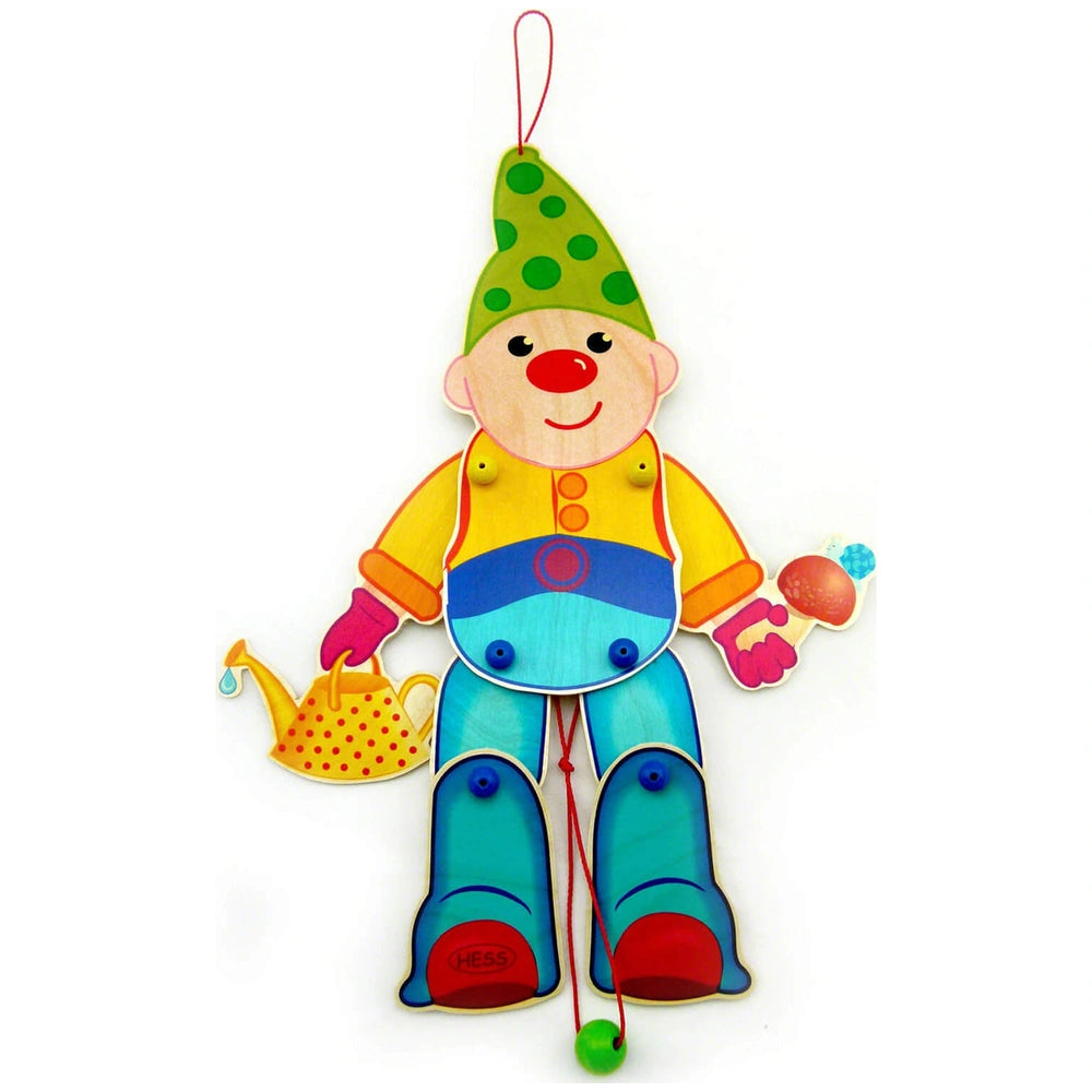 Hess Jumping Jack Dwarf toy features a glossy clown with a green hat, red nose, and colorful attire, holding balloons and a t