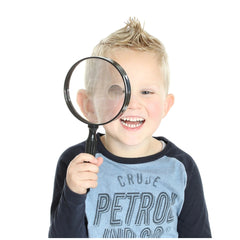 Johntoy Science Explorer Magnifying Glass held by a blonde child, showcasing curiosity and educational play.