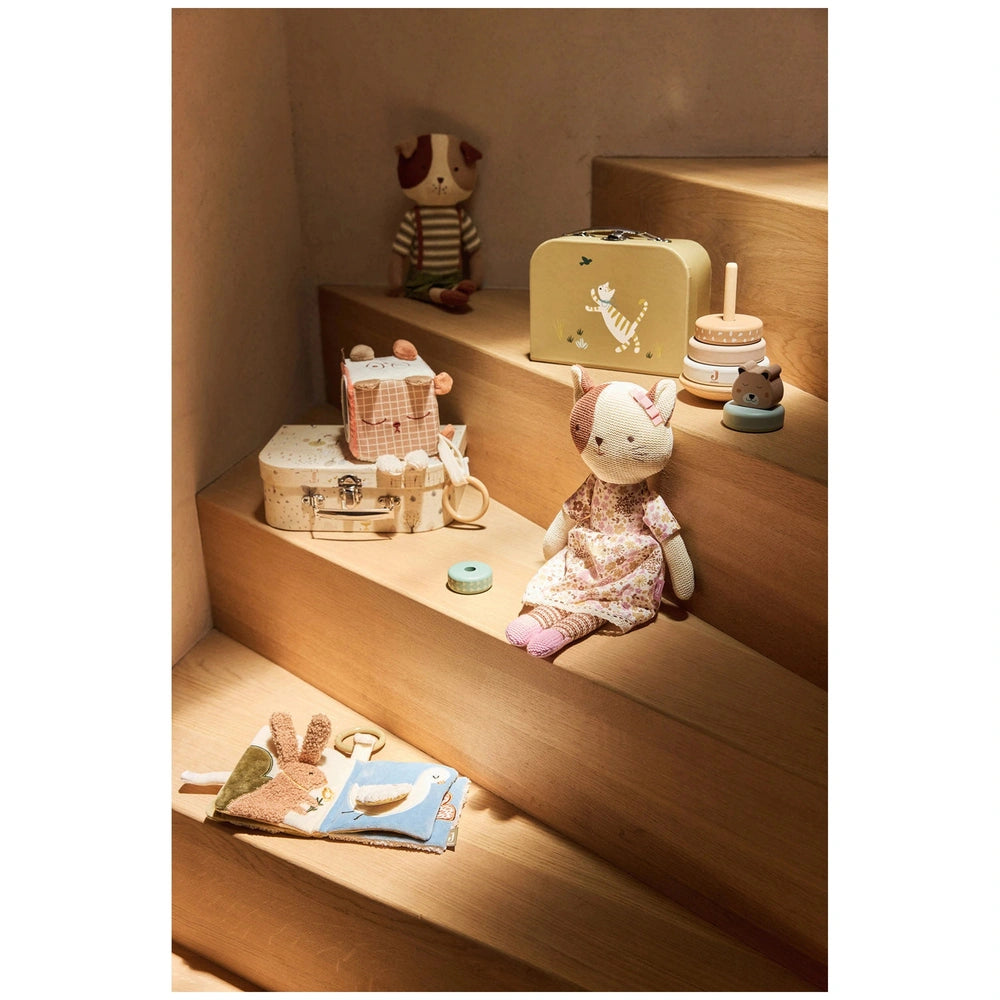 Jollein Activity Cube features colorful stuffed animals in dresses arranged on wooden steps, promoting interactive play for b