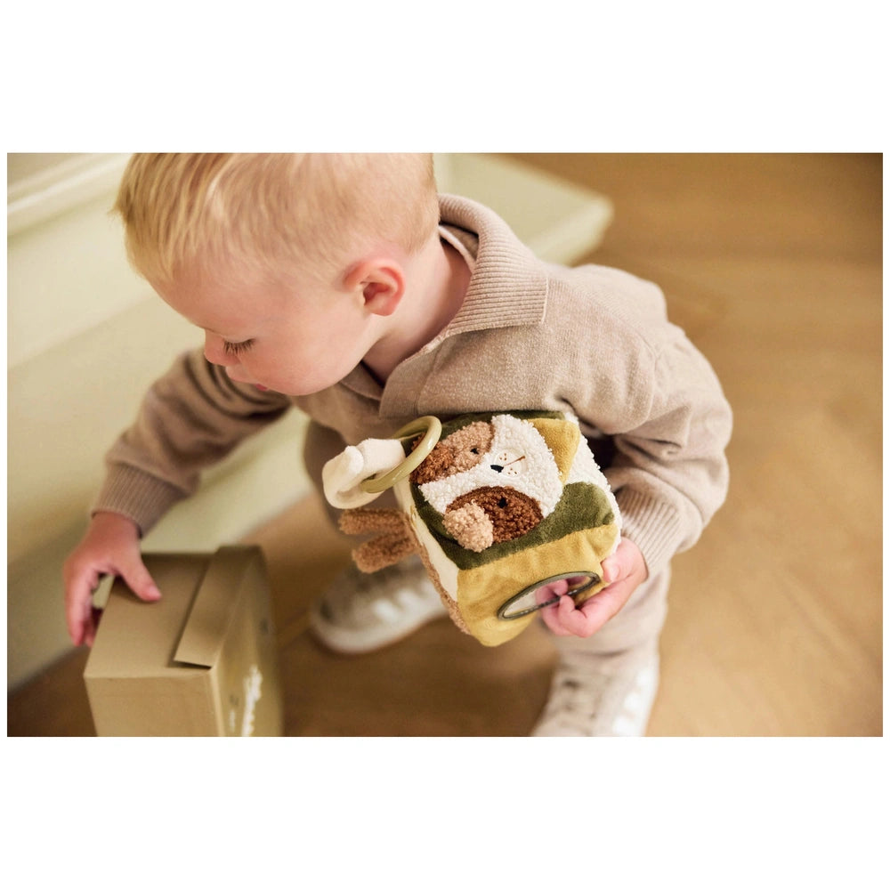 Jollein Activity Cube Tiny Park displayed with a child in beige clothing, holding a stuffed animal and small box on light woo