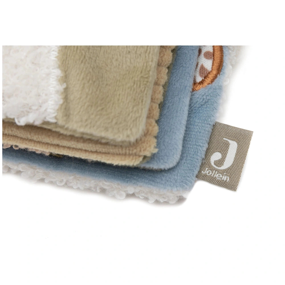 Jollein soft activity book with fuzzy blue, tan, and white fabric, featuring a matte plastic tag with a logo.