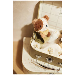 Jollein Wrist Rattle Tiny Park Mick Dog in a cardboard box with floral fabric interior and metal handle.