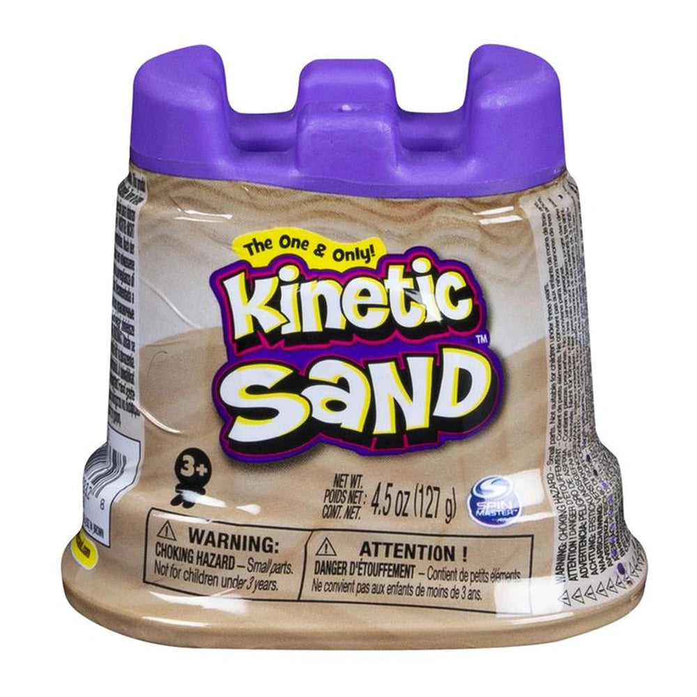 Kinetic Sand container with a brown body, purple lid, and a colorful label featuring brand name and caution symbols.