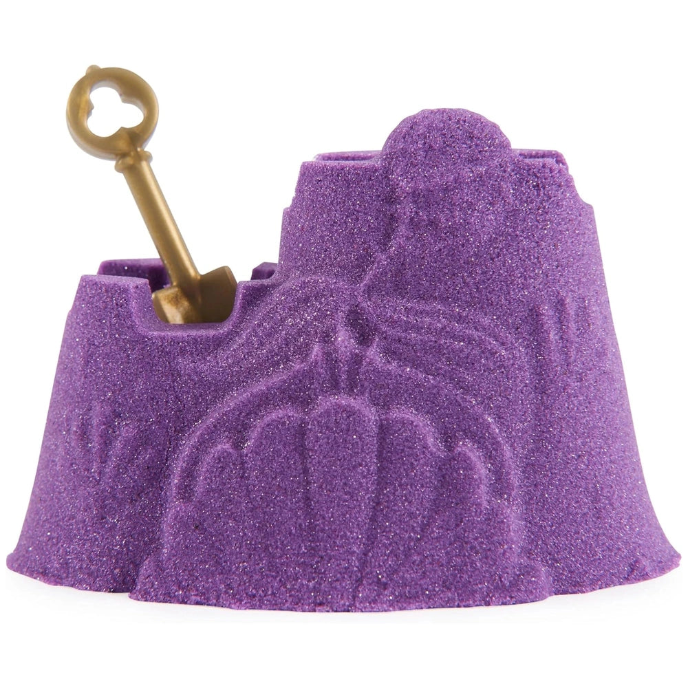 Kinetic Sand Mini Mermaid Lock features a glittery purple design with a golden key partially inserted into it.