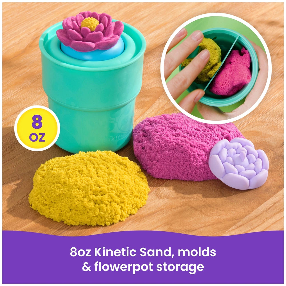 Kinetic Sand Squish Blossom in yellow mold, green container with blue lid, on wooden table, labeled "8oz Kinetic Sand".