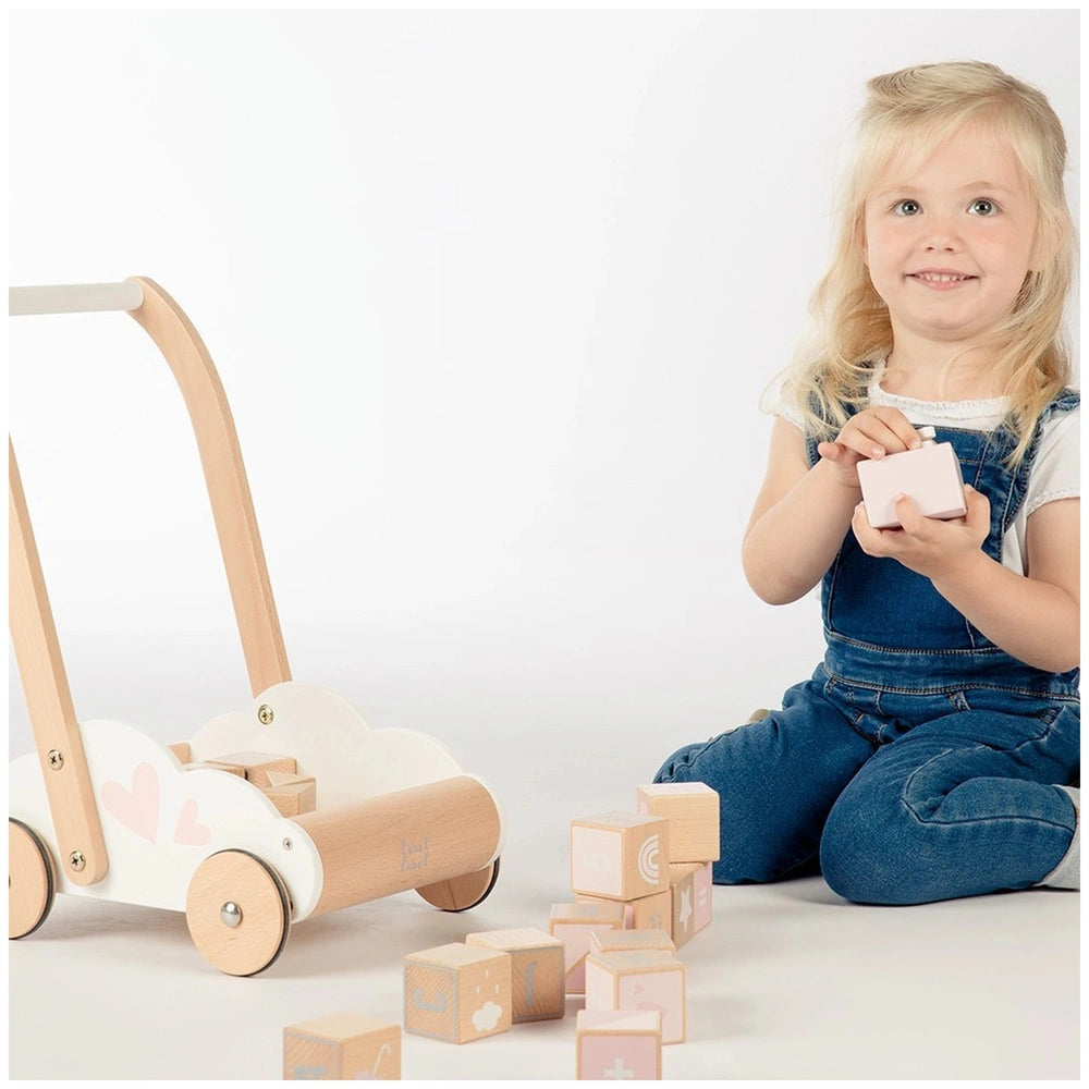 Label-Label educational baby walker features a wooden toy tractor, trailer, and numerous colorful wooden blocks for interacti