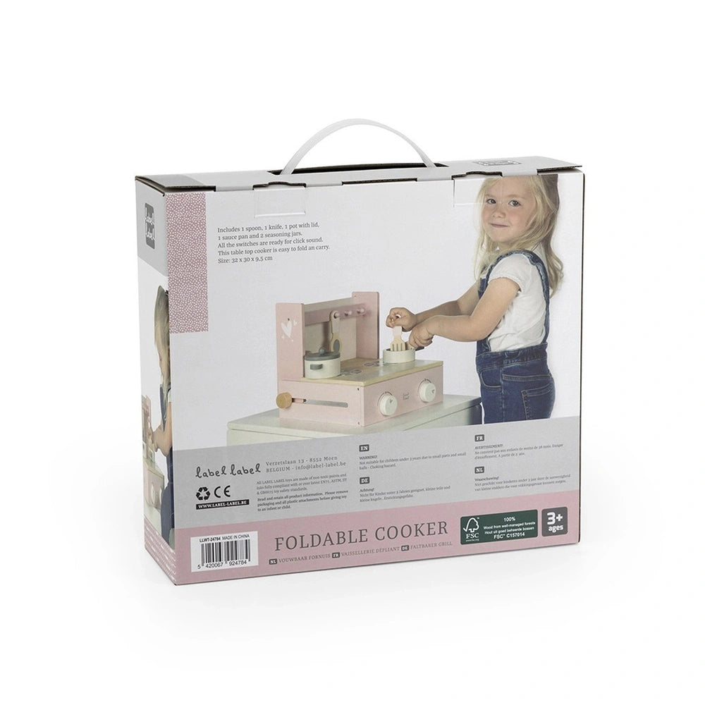 Foldable cooker toy packaging featuring a young girl with blonde hair using a pink oven, made of cardboard and plastic.
