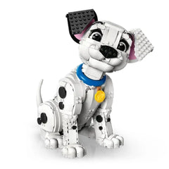 LEGO Dalmatians puppy construction set features a white dog with black spots, a blue collar, and a yellow tag, sitting attent