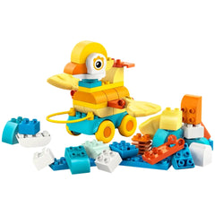 LEGO 3in1 Animals on Wheels set features a colorful character with a yellow body, white head, and blue hat on a yellow basepl