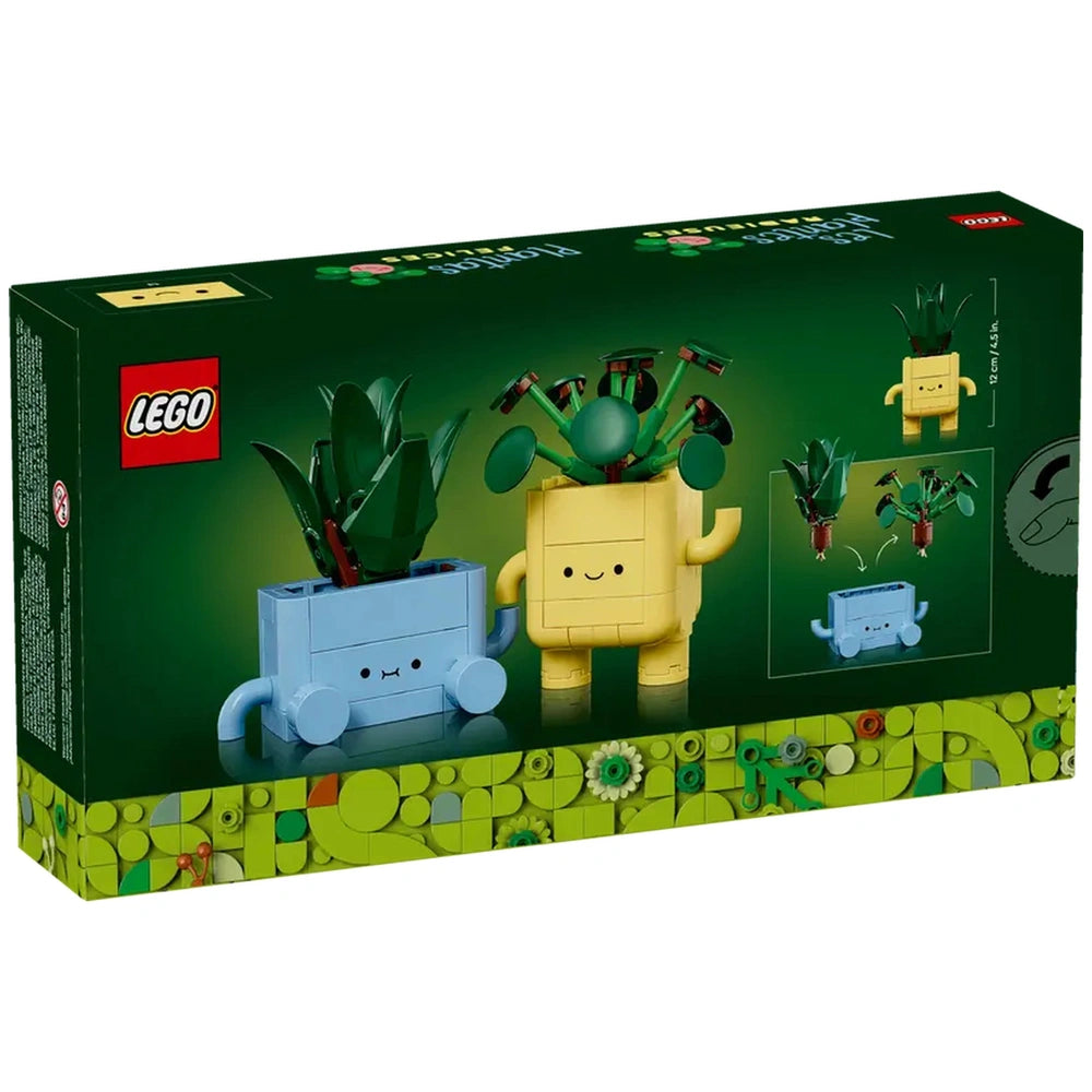 LEGO Botanicals Happy Plants construction set featuring a smiling yellow pot with green leaves and a blue pot with playful facial expression, set against a dark green background.