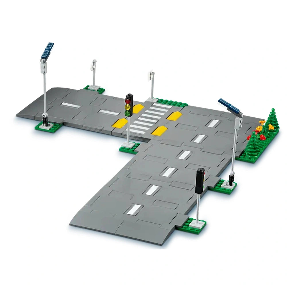LEGO City Road Plates construction set featuring five gray road plates, traffic lights, crosswalk, and decorative greenery.