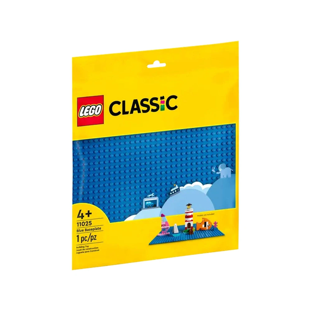 LEGO Classic Blue Baseplate in bright blue, packaged in a vibrant yellow box featuring playful illustrations of buildings, clouds, and a lighthouse.