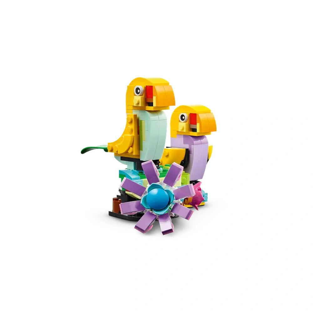 Colorful LEGO Creator set featuring two vibrant flower toys and two cheerful bird models with movable elements, set against a white background.