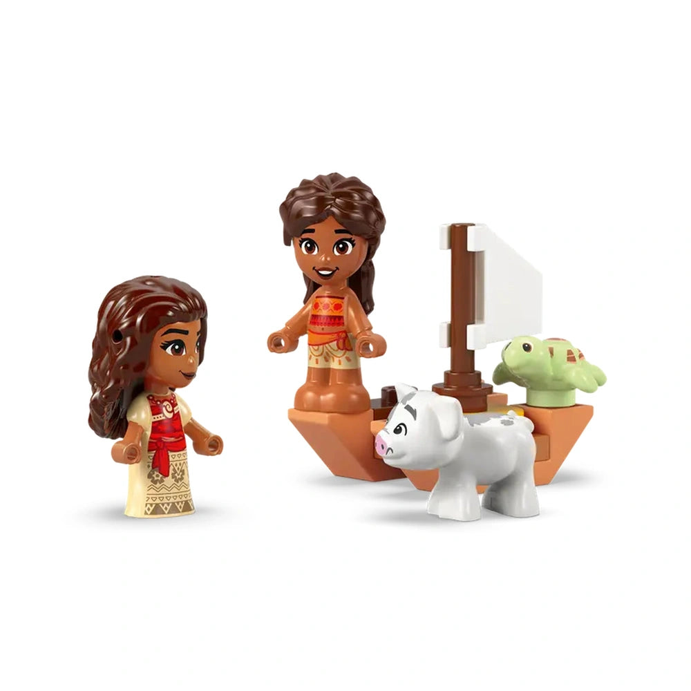 LEGO® micro-doll figures of Moana and her sister stand beside a colorful boat featuring a white pig and a green turtle.