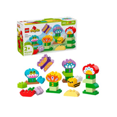 Colorful LEGO® DUPLO® Creative Garden & Flowers construction set featuring assorted bricks, flowers, and animal figures like a frog, butterfly, and bee.