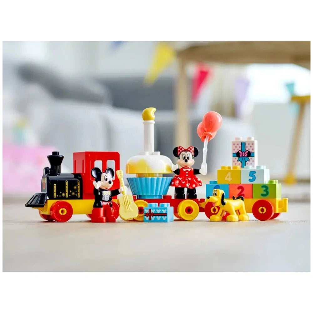 Colorful LEGO® DUPLO® Mickey & Minnie Birthday Train set featuring Mickey Mouse and Minnie Mouse holding a balloon, alongside playful train wagons, cake, and Pluto, all designed for toddler's imaginative play and fine motor skills development.