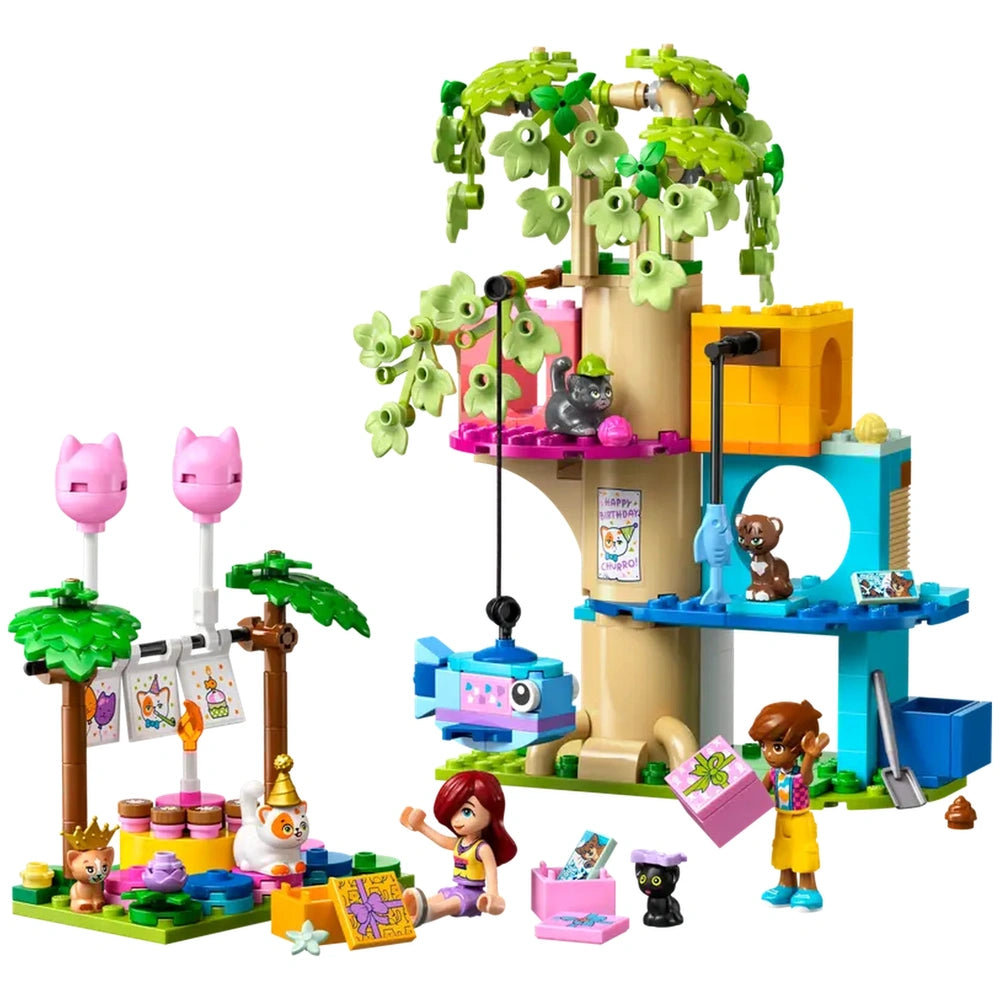 Colorful LEGO set featuring a tree house with a cat theme, birthday decorations, two minidolls, and playful cat figures.