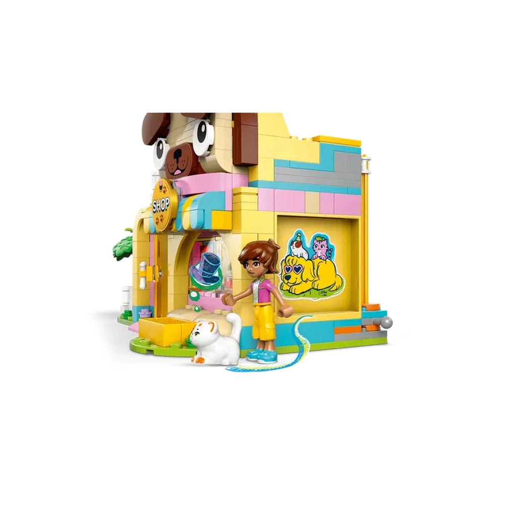 Colorful LEGO Friends Pet Accessories Shop with a large dog head on top, featuring a girl minidoll, a white cat, and vibrant accessories.