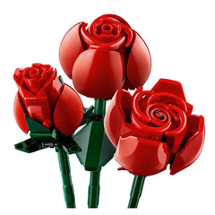 Three vibrant red LEGO® roses in varying stages of bloom, set on green stems, showcasing intricate petal designs and a realistic floral arrangement.