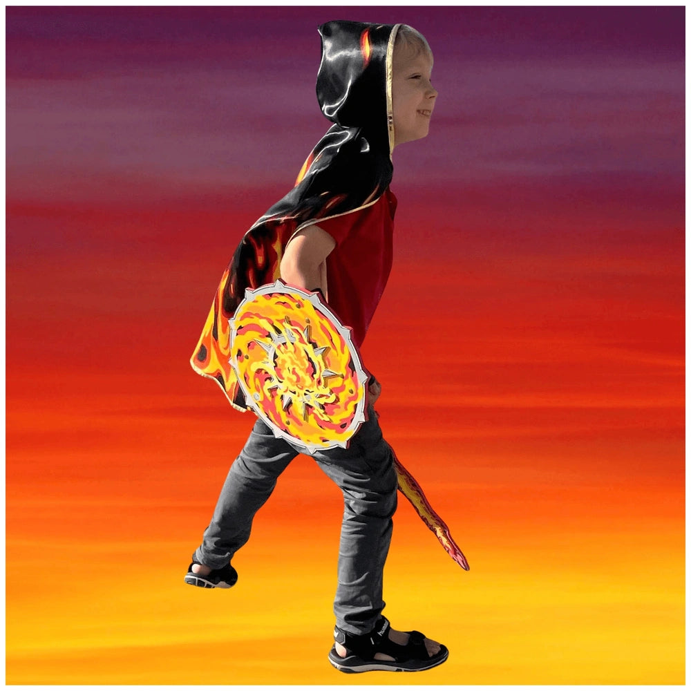 Liontouch Flame Shield held by a person in a black hooded cloak with flame design, gray pants, and black shoes.