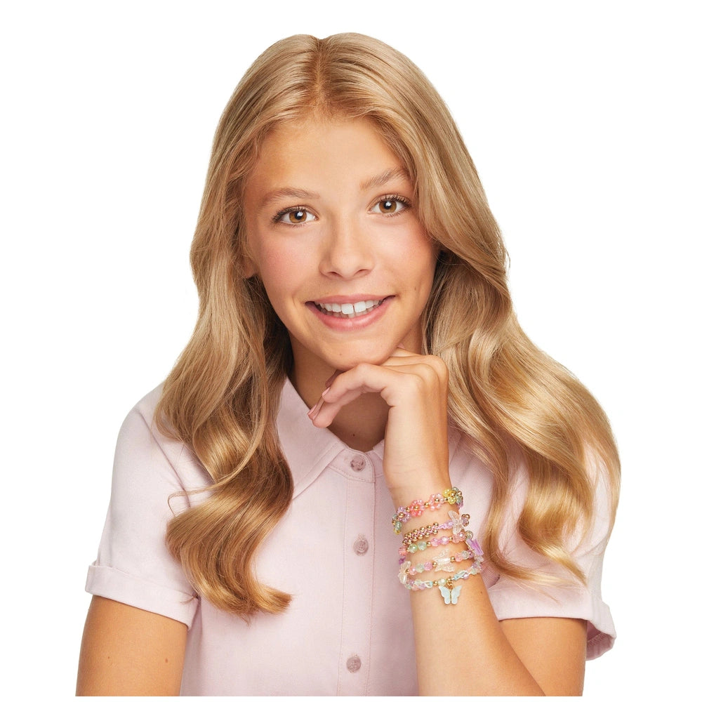 Butterfly Jewelry Set displayed with a smiling young woman in a light pink shirt and multi-colored bracelets.
