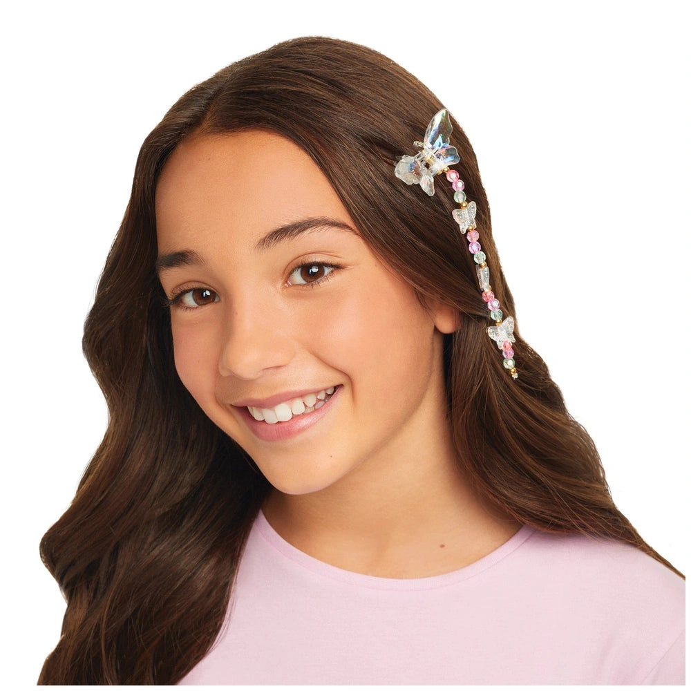 Butterfly Jewelry Set showcased on a smiling young girl with long brown hair and colorful earrings.
