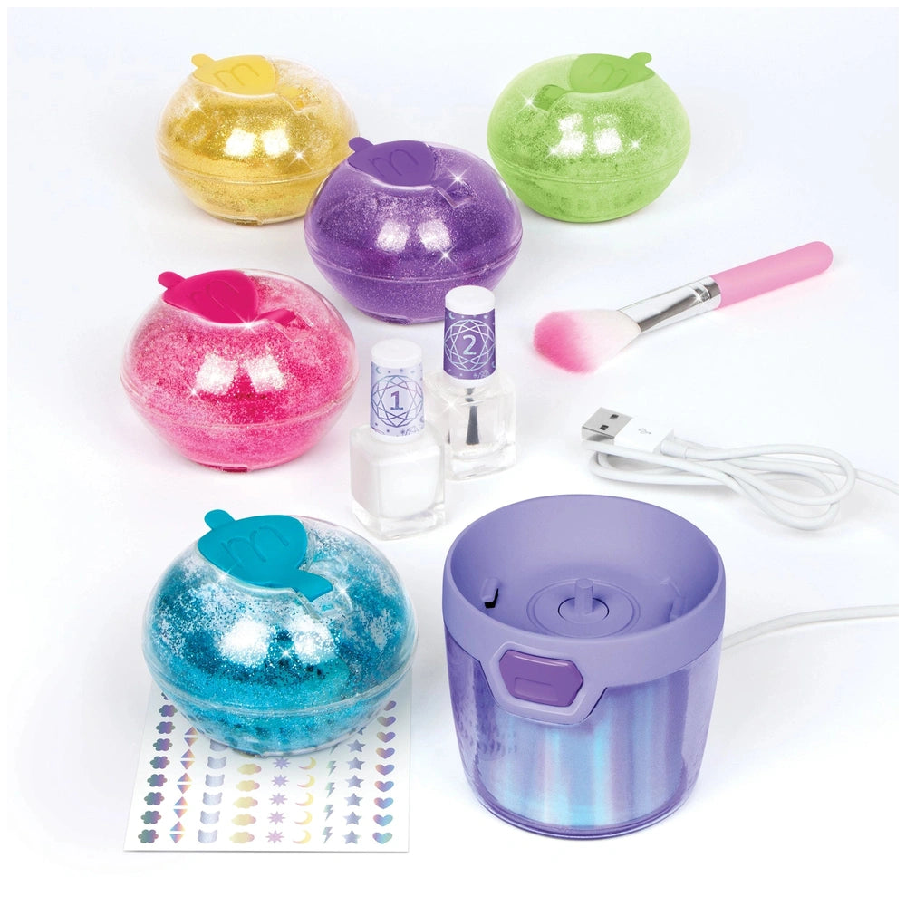 MAKE IT REAL Party Nails Glitter Nail Studio featuring glossy yellow, pink, purple, and green plastic tools on a white surfac
