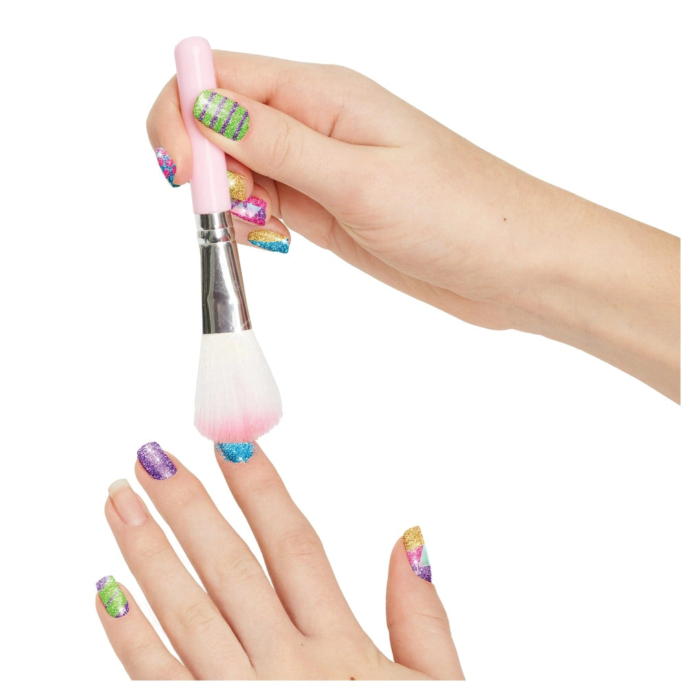 MAKE IT REAL Party Nails Glitter Nail Studio features a close-up of a green and purple striped nail polish bottle with a pink