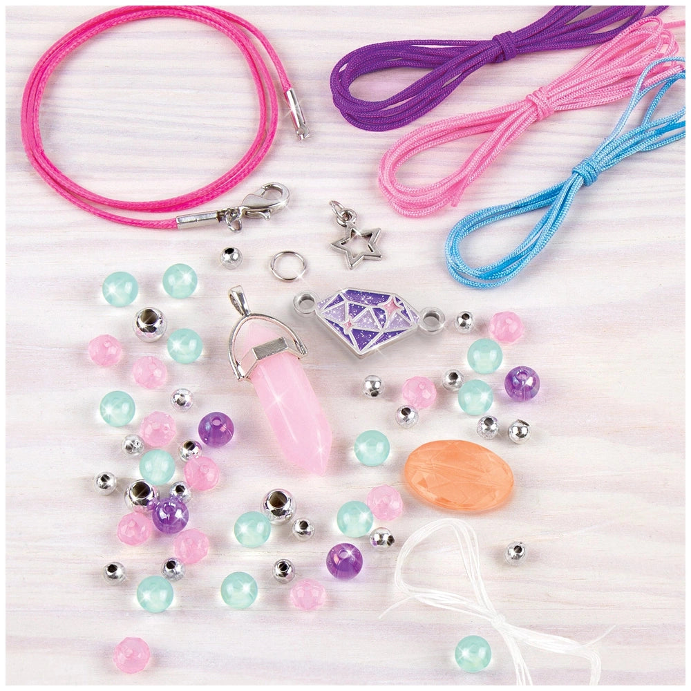 Positive Gems Jewelry set with pink, purple, and blue strings, featuring silver-colored metal chains and beads.