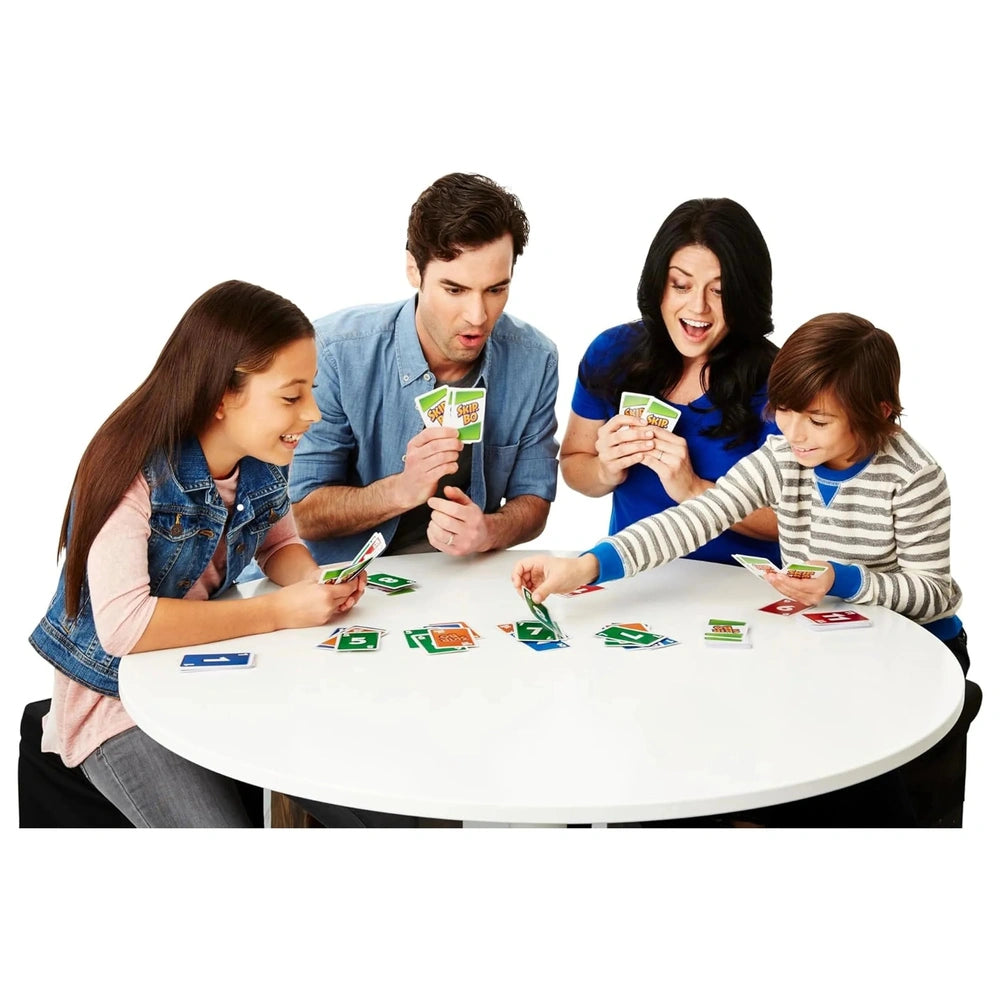 Mattel Skip-Bo Ultimate Sequencing Card Game with four people playing around a round white table, holding glossy green and wh