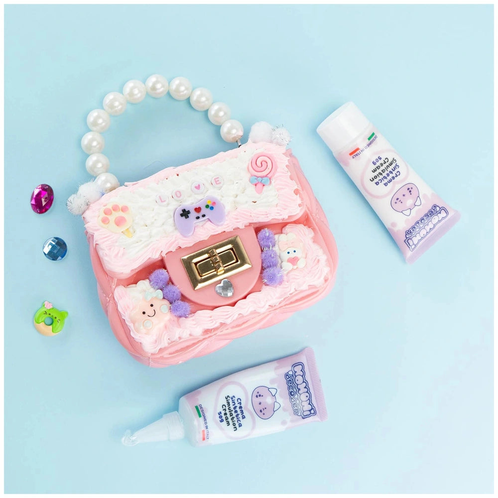 Momomi Decoden Kawaii Artist Creamy Bag in pink with white and purple decorations and white pearls, showcasing playful design