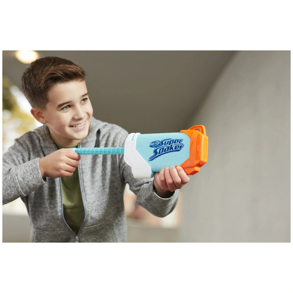 Nerf Super Soaker Torrent Water Blaster held by a boy in a gray hoodie, featuring a blue body, orange handle, and multiple la