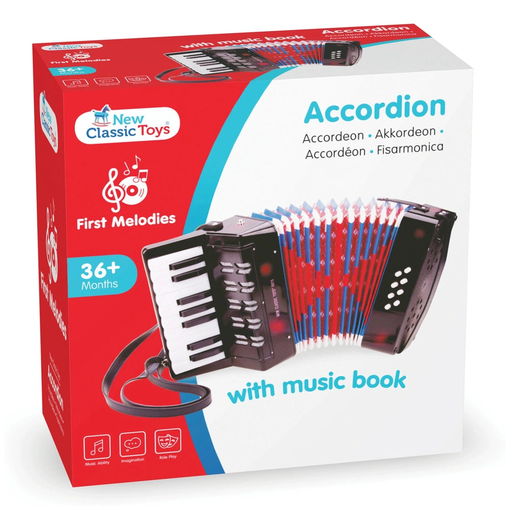 New Classic Toys accordion in red box with music book, featuring white and black keys, buttons, and colorful accents.