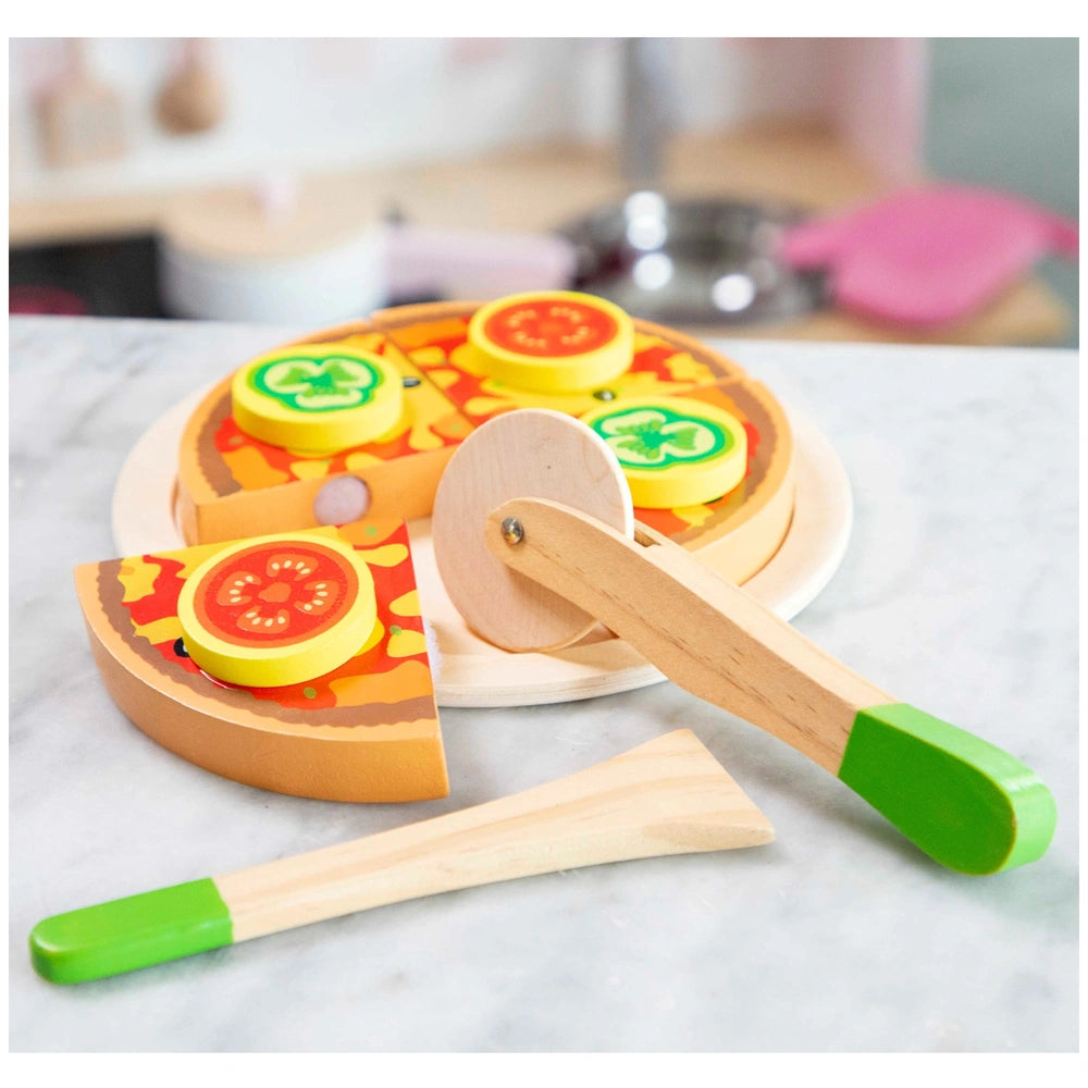 New Classic Toys pizza vegetable cutting set featuring a wooden surface and colorful plastic knives and pizza cutters.