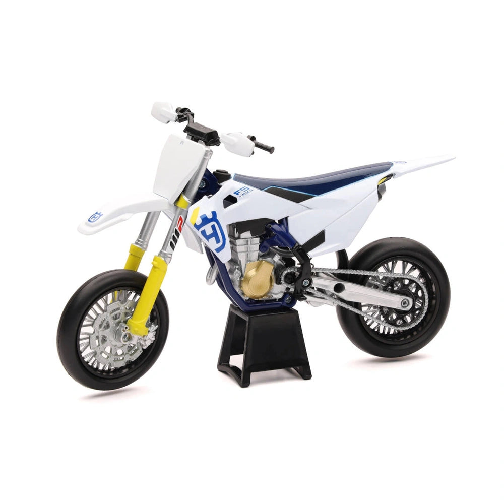 Husqvarna FS450 2019 die-cast motorcycle model features a silver frame, blue seat, and white fenders with silver-spoked wheel