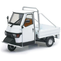 Piaggio Ape 50 Cross Country die-cast model in white plastic with black accents, silver roof rack, and transparent windows.